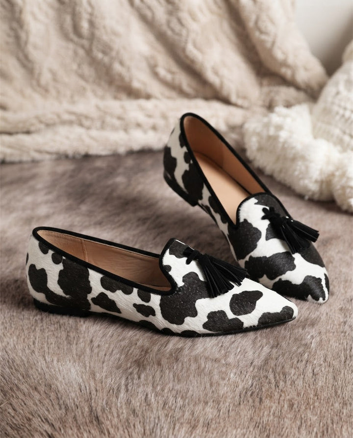 Ginevra Moccasin — Black and White Cow Print, Black Tassels